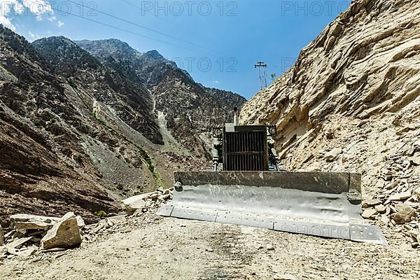 Bulldozer doing mountain road construction in Himalayas. Himachal Pradesh