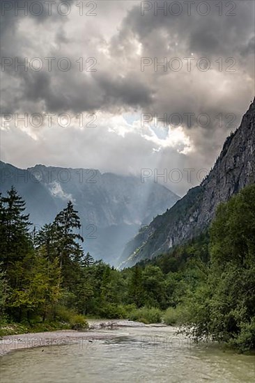 Torrener Ache in the Bluntau valley with dramatic clouds