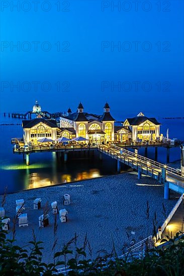 Pier in the Baltic seaside resort Sellin on the island of Ruegen on the Baltic Sea at night in Sellin