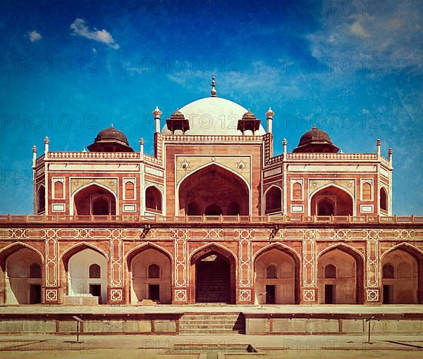 Vintage retro hipster style travel image of Humayun's Tomb with overlaid grunge texture. Delhi