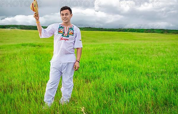 Man wearing Central American folk costume. Young man in cultural and folk costume from Nicaragua. Concept of man in Nicaraguan folk costume