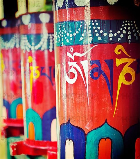 Vintage retro effect filtered hipster style travel image of Buddhist prayer wheels. Tsuglagkhang complex in McLeod Ganj