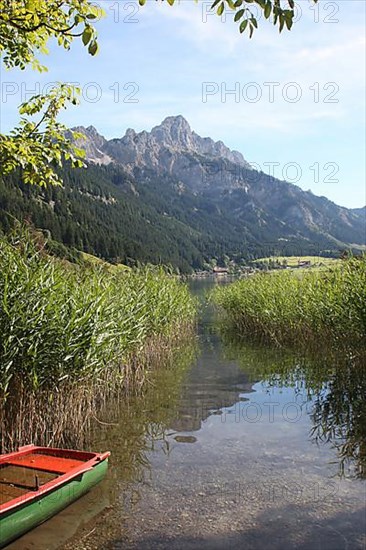 Haldensee with view of Gimpel and Rote Flueh in the Tannheim Valley