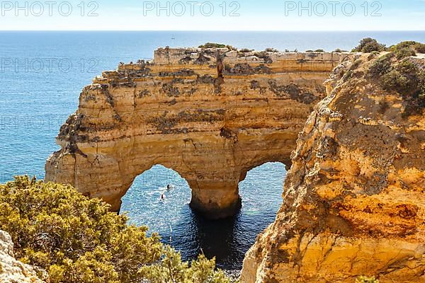 Algarve beach Praia da Marinha by the sea Rock formation in the shape of a heart Ocean in Praia da Marinha