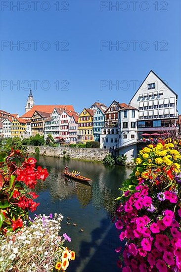 City on the Neckar River with punting boat in Tuebingen