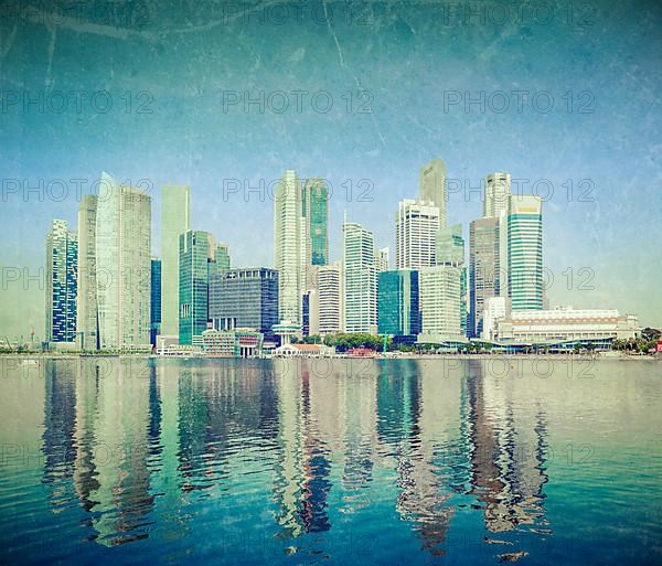 Modern city skyline of business district downtown of Singapore in day with grunge texture overlaid