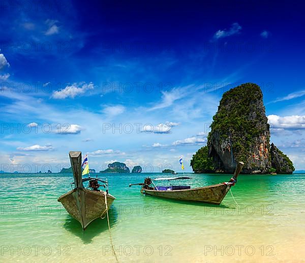 Long tail boats on tropical Pranang beach