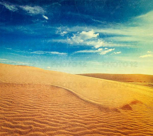 Vintage retro hipster style travel image of white sand dunes on sunrise