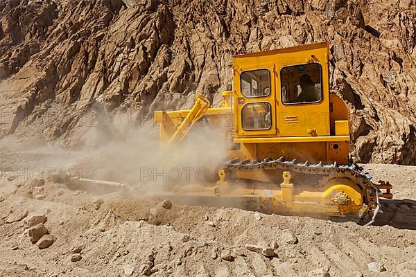 Bulldozer doing road construction in Himalayas. Ladakh