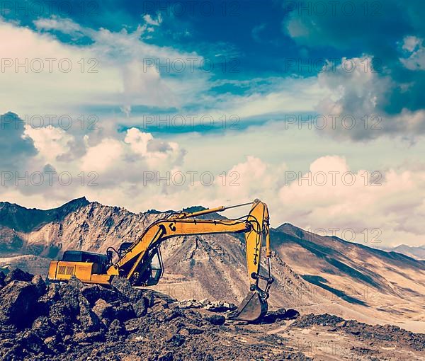 Vintage retro effect filtered hipster style travel image of Road construction in mountains Himalayas. Ladakh