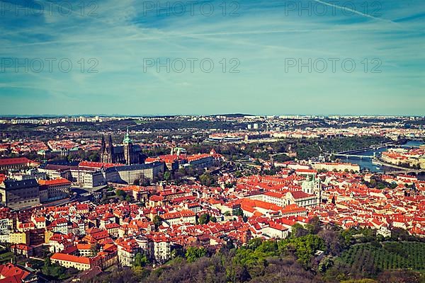 Vintage retro hipster style travel image of aerial view of Hradchany part of Prague the Saint Vitus St. Vitt's Cathedral and Prague Castle