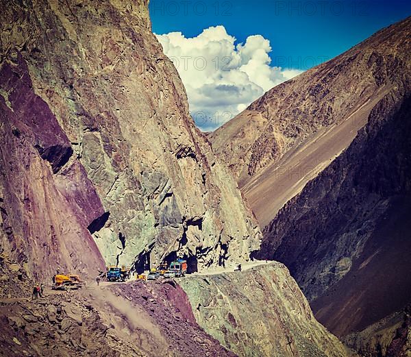 Vintage retro effect filtered hipster style travel image of Road construction in Himalayas. Ladakh