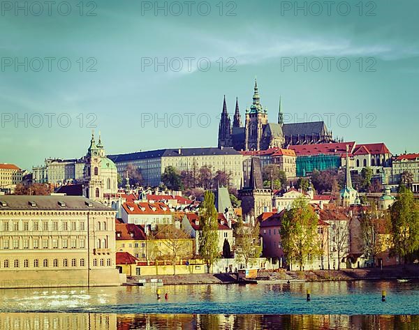 Vintage retro hipster style travel image of Mala Strana and Prague castle over Vltava river. Prague