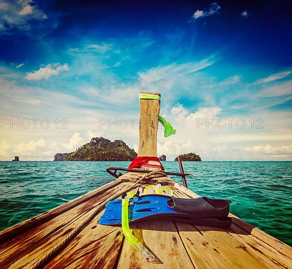 Vintage retro effect filtered hipster style travel image of snorkeling set on boat