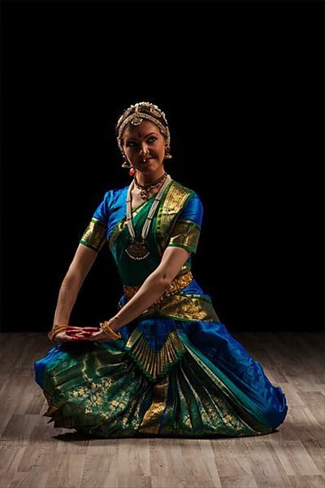 Young beautiful woman dancer exponent of Indian classical dance Bharatanatyam