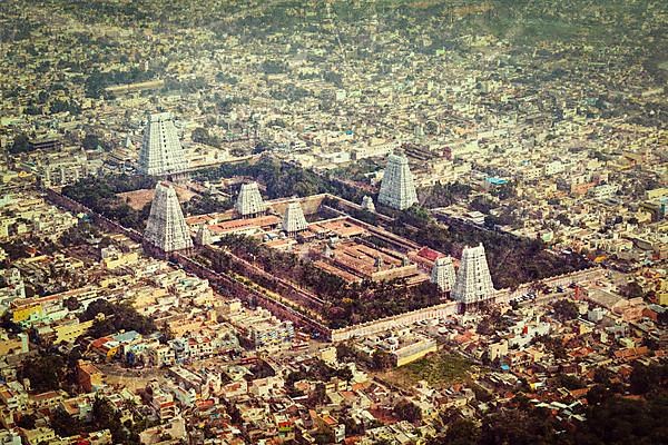 Vintage retro hipster style travel image of Hindu temple and indian city aerial view with grunge texture overlaid. Arulmigu Arunachaleswarar Temple