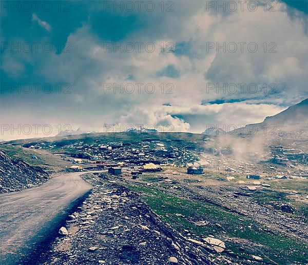 Vintage retro effect filtered hipster style travel image of Road in Himalayas on top of Rohtang La pass