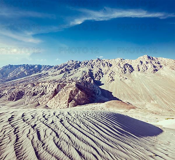 Vintage retro effect filtered hipster style travel image of Sand dunes in Himalayas. Hunder