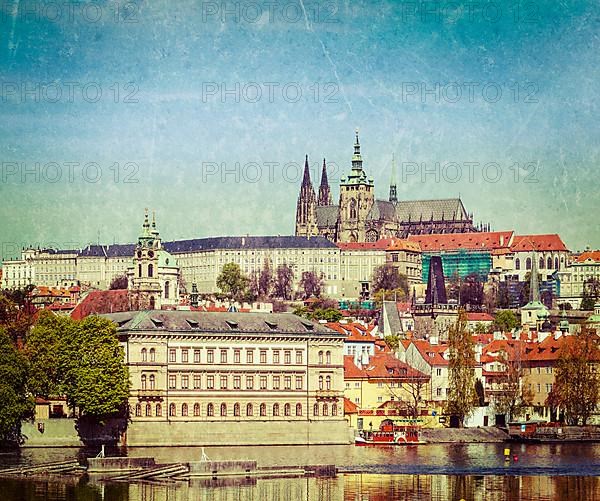 Vintage retro hipster style travel image of Charles bridge over Vltava river and Gradchany