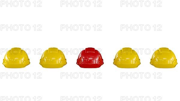 Line of yellow safety helmets hard hats of construction workers with a red one isolated on white