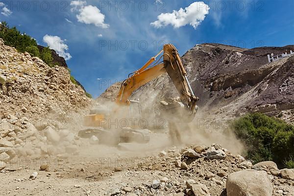 Excavator doing road construction in Himalayas. Ladakh