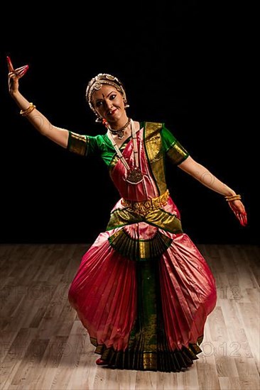 Young beautiful woman dancer exponent of Indian classical dance Bharatanatyam