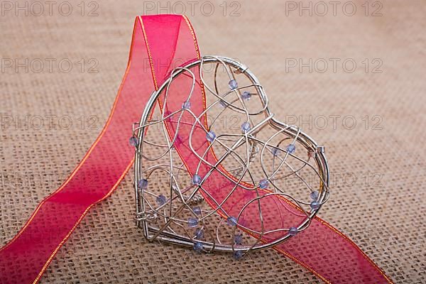 Band and Heart shaped cage on linen canvas