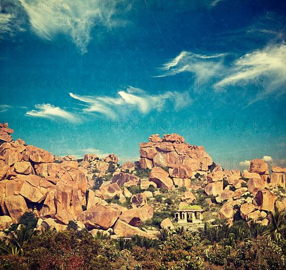 Vintage retro hipster style travel image of Ancient ruins of Hampi. Karnataka