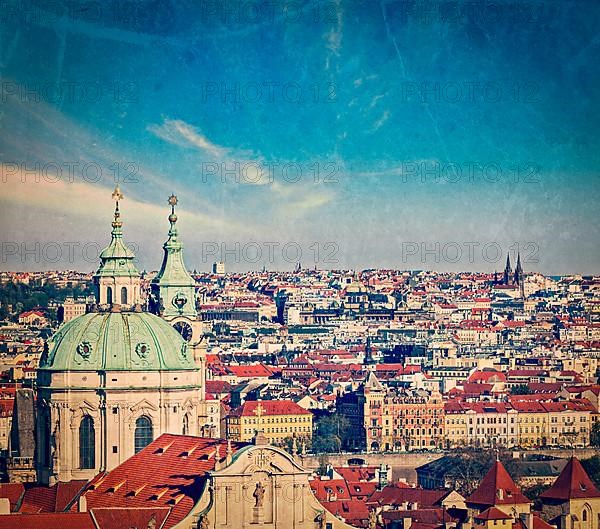 Vintage retro hipster style travel image of aerial view of Prague from Prague Castle. Prague