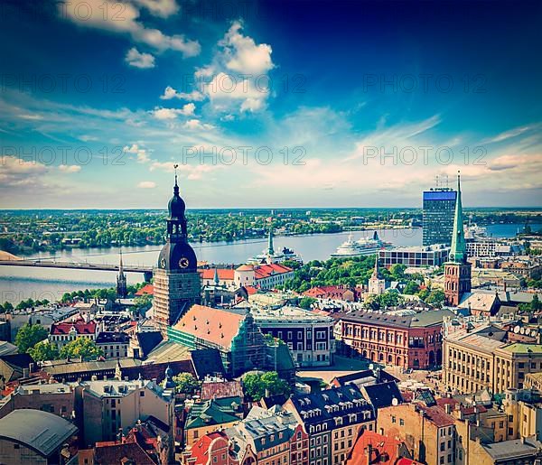 Vintage retro hipster style travel image of aerial view of Riga center from St. Peter's Church