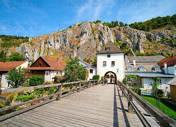 Old wooden bridge over the branch of the Altmuehl and Randeck Castle