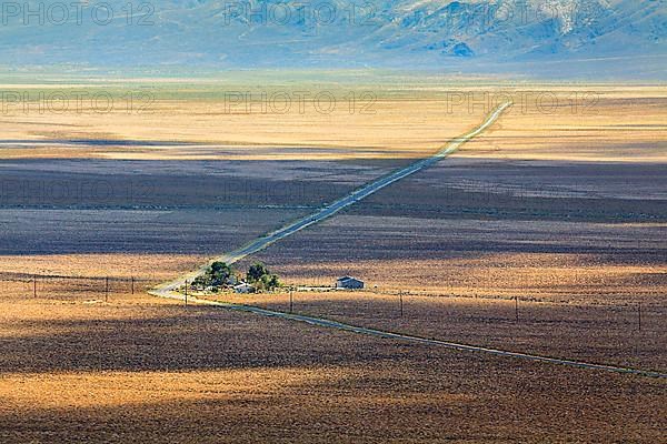 Lonely long road through desert landscape