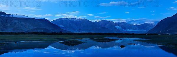 Panorama of Nubra valley in Himalayas after sunset in twilight. Ladakh