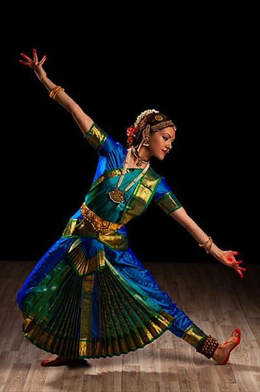 Young beautiful woman dancer exponent of Indian classical dance Bharatanatyam