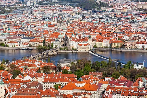 Aerial view of Charles Bridge over Vltava river and Old city from Petrin hill Observation Tower. Prague