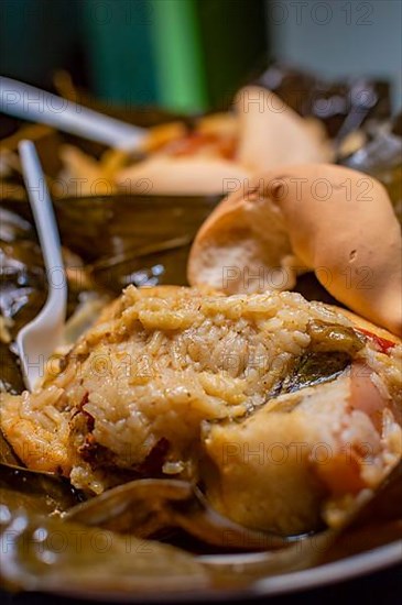 Nacatamales with bread served on table