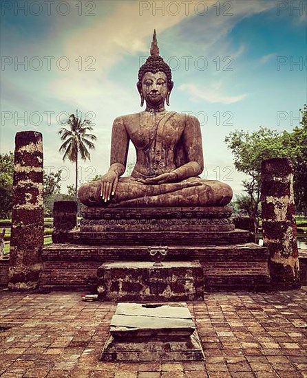 Vintage retro effect filtered hipster style travel image of Buddha statue hand close up detail. Sukhothai