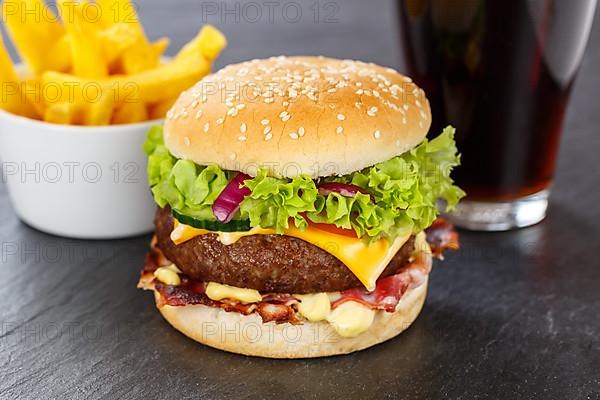 Hamburger Cheeseburger Fast Food Meal Menu with Fries and Cola Drink on Slate in Stuttgart