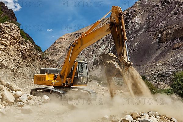 Excavator doing road construction in Himalayas. Ladakh