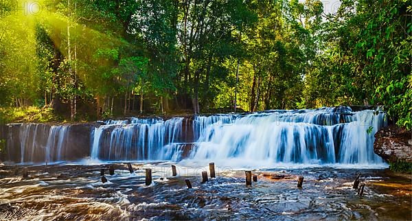 Tropical waterfall Phnom Kulen on sunrise