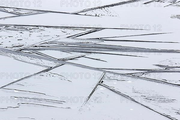 Creative photo. Patterns on a frozen lake