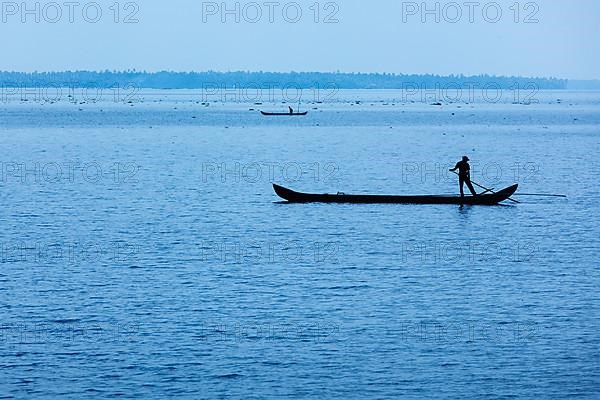 Man on boat. Kerala