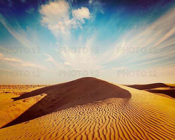 Vintage retro hipster style travel image of dunes of Thar Desert. Sam Sand dunes