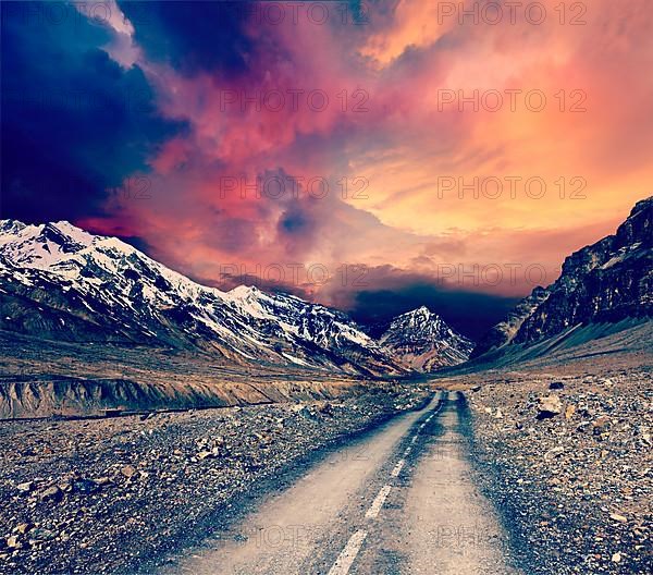 Vintage retro effect filtered hipster style travel image of road in mountains