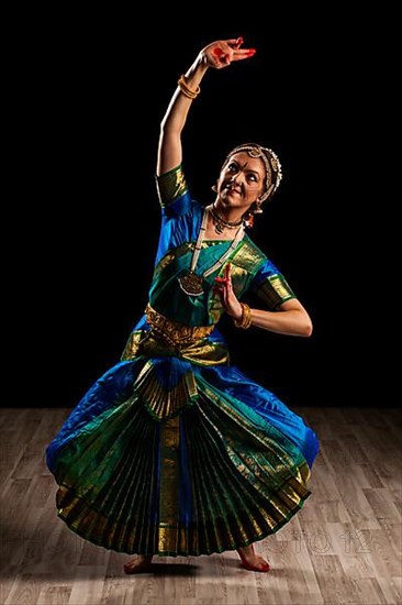 Young beautiful woman dancer exponent of Indian classical dance Bharatanatyam