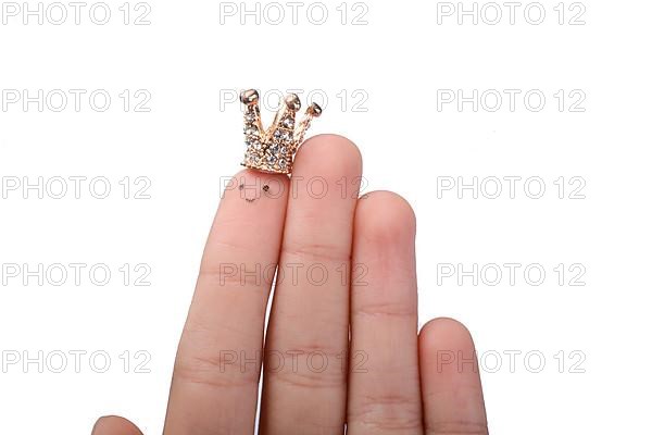 Finger with dots like a face and a crown on the top