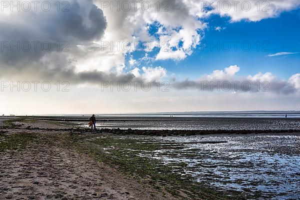 Walkers on the Wadden Sea in autumn