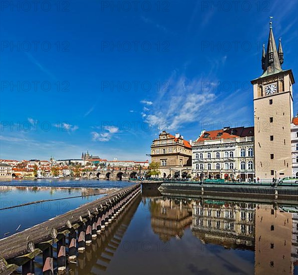 Prague Stare Mesto embankment view from Charles bridge on sunset. Prague