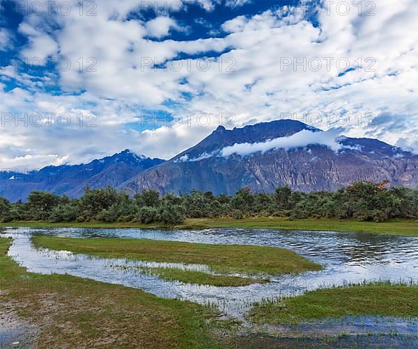 Panorama of Himalayas and landscape of Nubra valley on sunset. Hunber