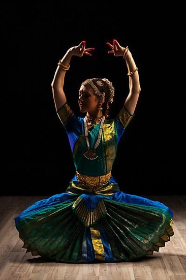 Young beautiful woman dancer exponent of Indian classical dance Bharatanatyam